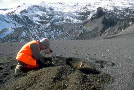 PPhotograph of geologist digging pit in tephra fall deposit
