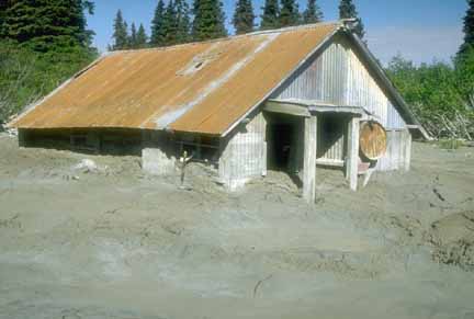 Photograph of shed half filled with lahar deposit