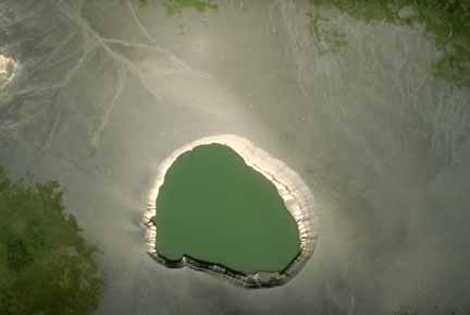 Photograph from air looking down on maar crater