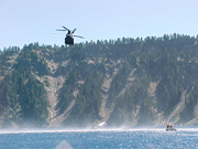 [Photo of helicopter over lake] 