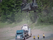 [Close-up photo of helicopter over truck] 