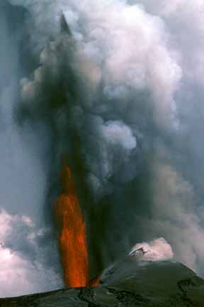 photo 031.  Photo of fountain of red-hot lava and gray ash shooting skyward with great velocity from crater