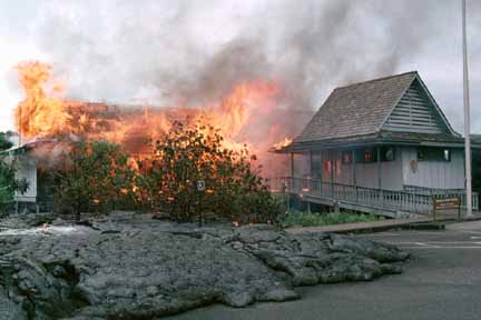 photo 052.  Photo of National Park Service Visitors Center going up in flames as lava flows out onto parking lot