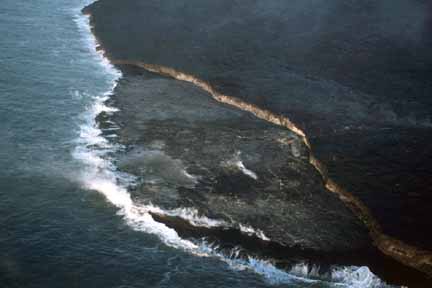 photo 095.  Low-elevation oblique aerial photo of lava flow entering sea