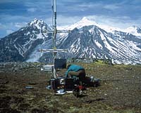 Scientist installing seismometer near Mount Spurr volcano